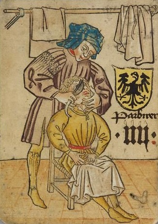Image médiévale d'un barbier