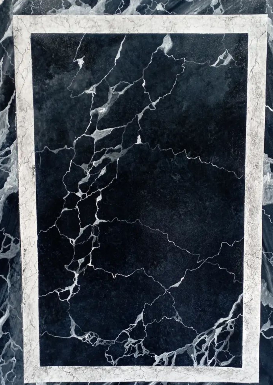 Fond de marbre noir avec une bande de marbre blanc incrustée